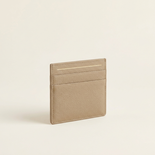 The Vesper Card Case in Taupe — slim lychee-grain card holder with gold-tone detail
