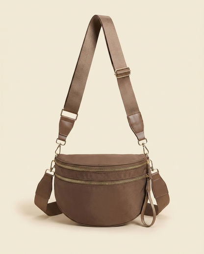 The Crescent Shoulder Bag in Taupe — front view with adjustable webbing strap