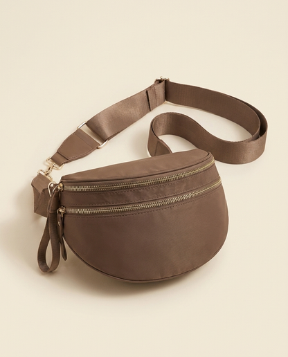 The Crescent Shoulder Bag in Taupe — three-quarter angle view