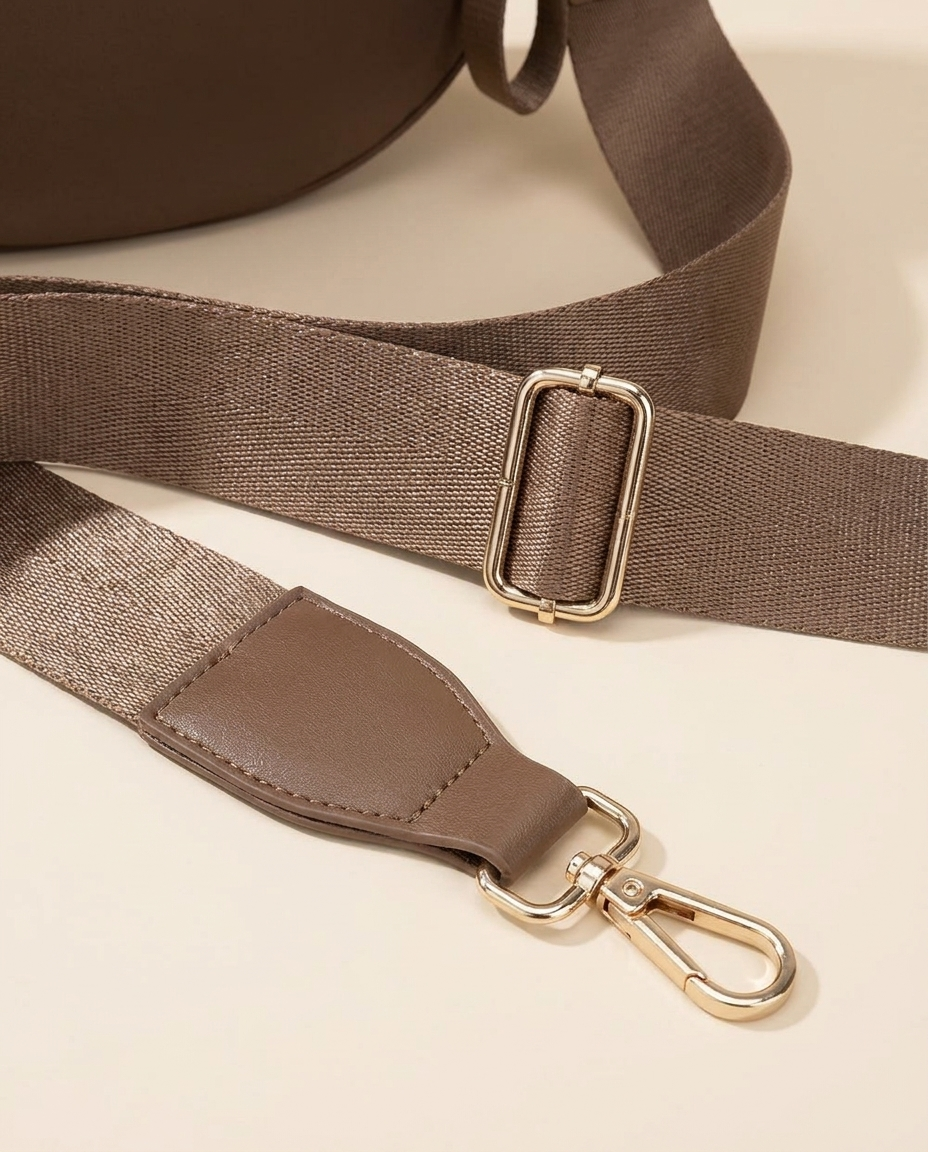 The Crescent Shoulder Bag — detail of adjustable strap with gold-tone buckle and clasp