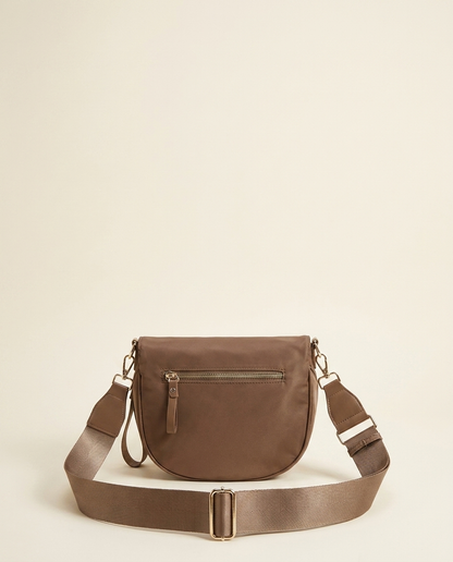 The Crescent Shoulder Bag in Taupe — back view with hidden zip pocket