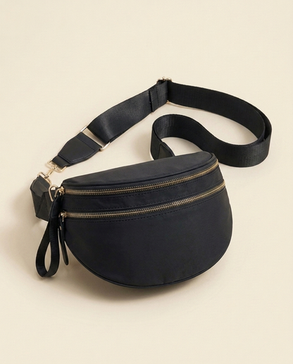 The Crescent Shoulder Bag in Ink — three-quarter angle view