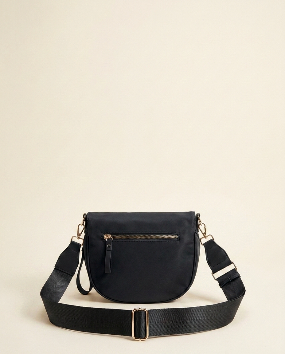 The Crescent Shoulder Bag in Ink — back view with hidden zip pocket