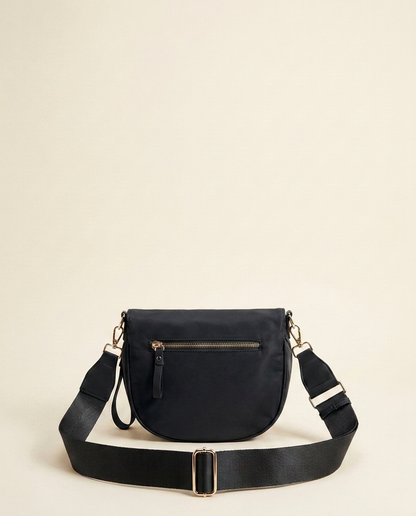 The Crescent Shoulder Bag in Ink — back view with hidden zip pocket