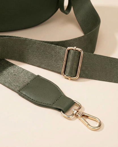 The Crescent Shoulder Bag in Forest — detail of adjustable strap with gold-tone hardware
