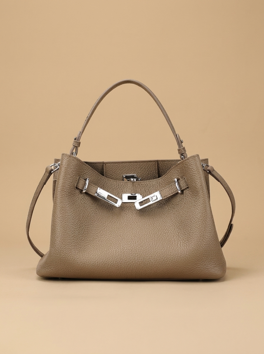 Héloïse Leather Shoulder Bag studio shot on warm sand backdrop