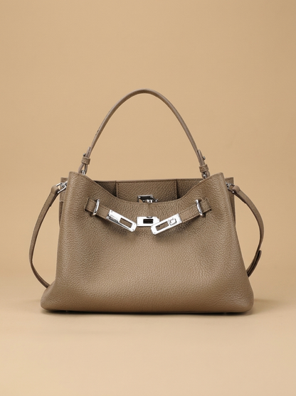 Héloïse Leather Shoulder Bag studio shot on warm sand backdrop