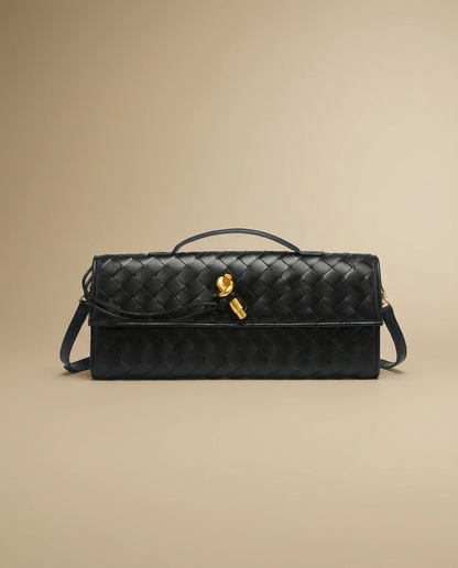 Adèle Woven Clutch by Aurevy on a warm sand studio backdrop