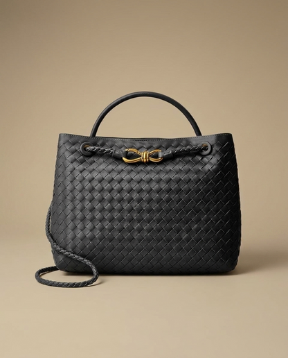 Camille Woven Handbag by Aurevy on a warm sand studio backdrop